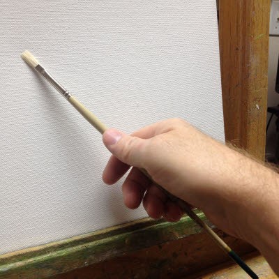 Holding an artist paint brush