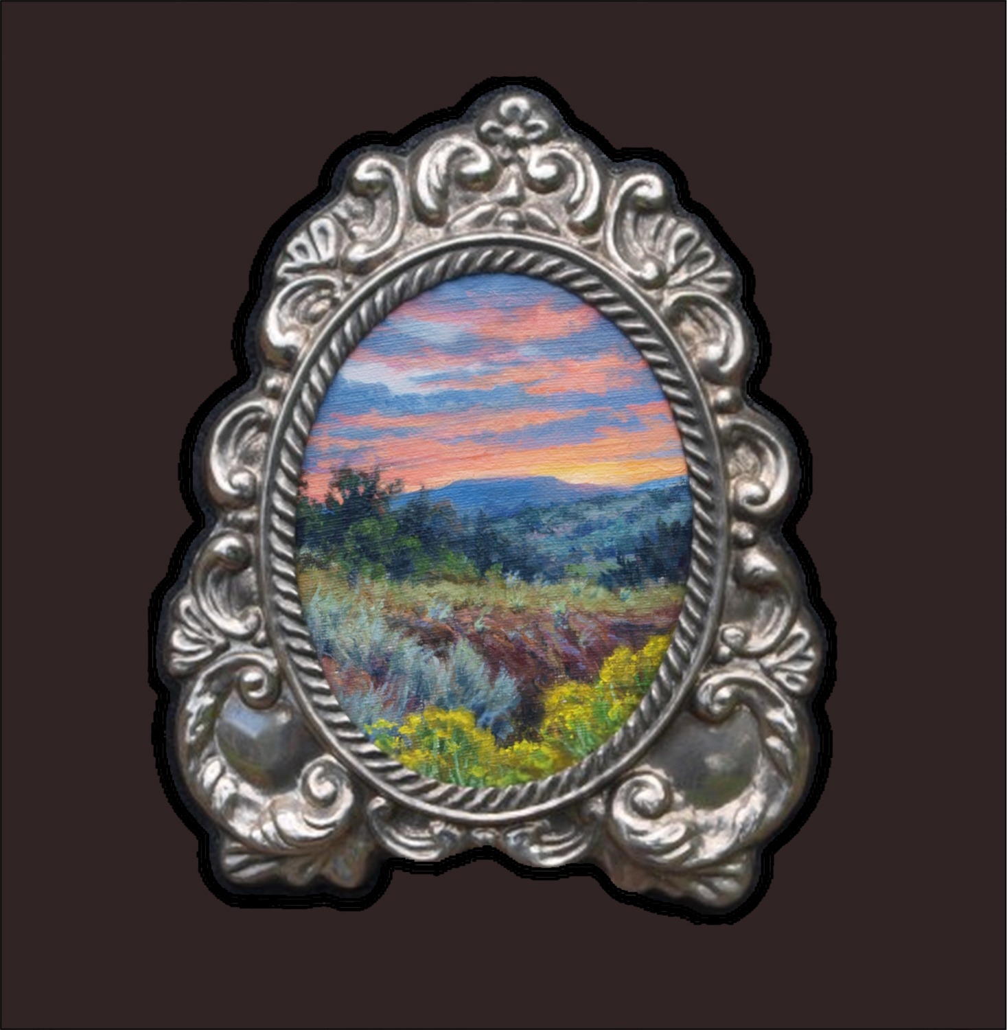 Original New Mexico landscape miniature in an ornate vintage silver‑plate oval frame, featuring soft high‑desert hills and a glowing sunset sky painted by William Hagerman.